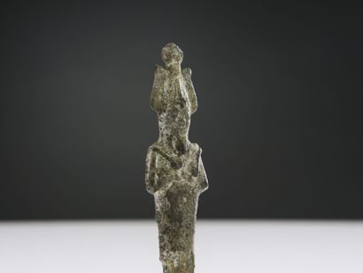 null Statuette of mummiform Osiris standing. He is wearing the Atef crown, has his...