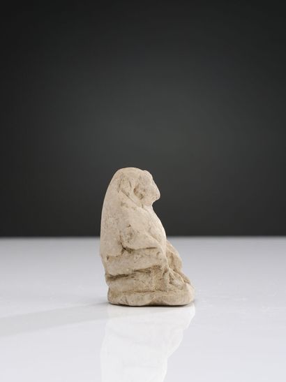 null Large amulet in the form of a seated baboon Thot, hands on legs spread.
Limestone....