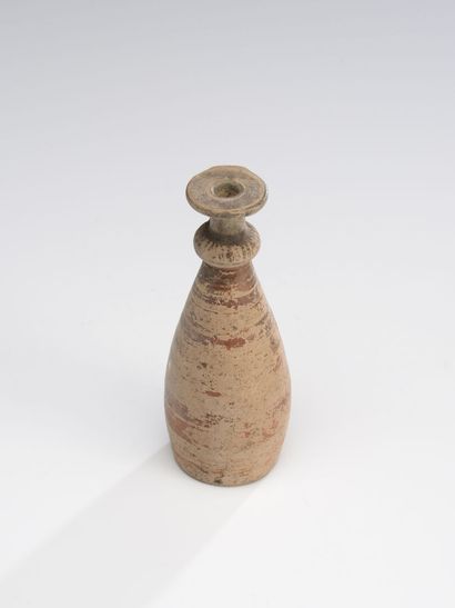 null Alabaster piriform with flat bottom and beading at the base of the neck. It...