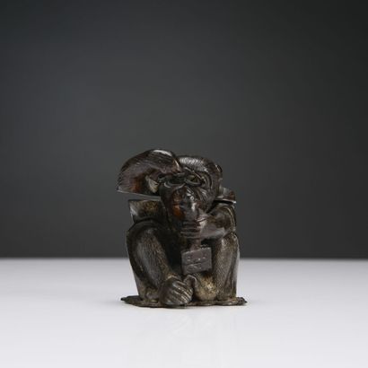 null JAPAN, Metal inkwell featuring a seated macaque holding bezels and observing...