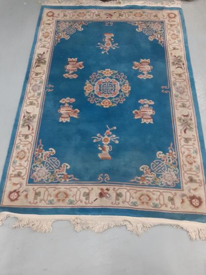 CHINA Tientsin. 
carpet with blue background.
Embroidered...