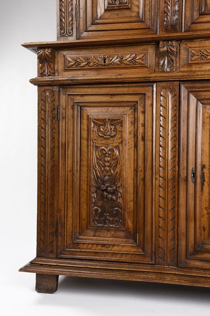 null Piece of furniture with two recessed bodies in carved walnut, it opens with...