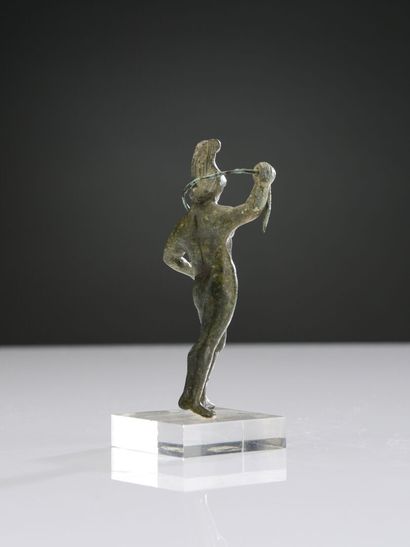 null Statuette of naked Mars, helmeted, raising his right arm. He is holding a snake...