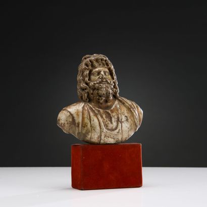 Draped bust of Serapis. The beard and hair...