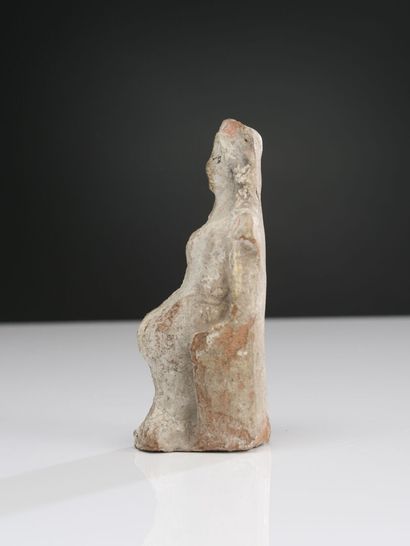 null Female figure seated on a throne with high back, hands on knees. She is wearing...