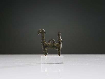 null Pendeloque with double protome representing a stylized griffin. 
Bronze with...