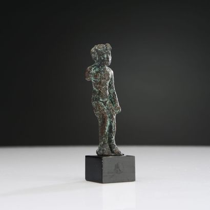 null Statuette of Harpocrates-Horus as a child, depicted naked, with his arms along...