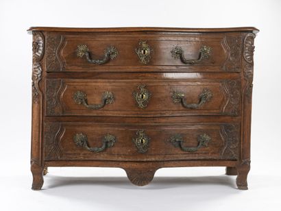 null Walnut chest of drawers molded and carved it opens with three drawers in front....
