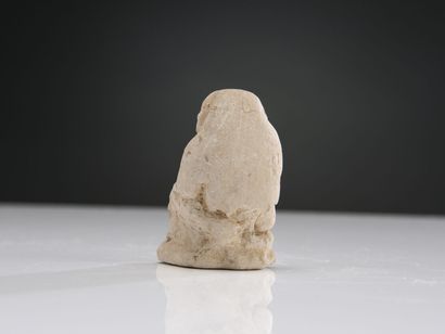 null Large amulet in the form of a seated baboon Thot, hands on legs spread.
Limestone....