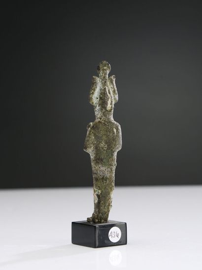 null Statuette of mummiform Osiris standing. He is wearing the Atef crown, has his...