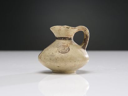 null Lot including a jug with high neck and flared lip, decorated with bands on the...