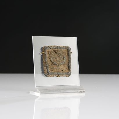null Quadrangular weight stamped with two cornucopia and an inscription in Greek...