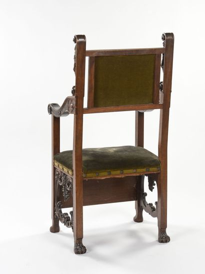 null Pair of armchairs with carved walnut arms. The amount of the backs is formed...