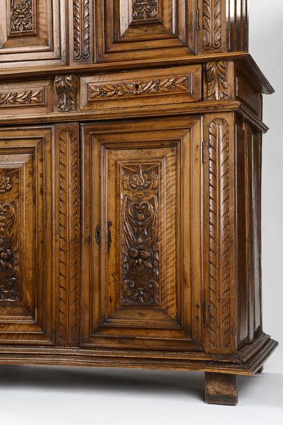 null Piece of furniture with two recessed bodies in carved walnut, it opens with...
