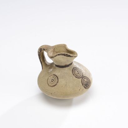 null Lot including a jug with high neck and flared lip, decorated with bands on the...