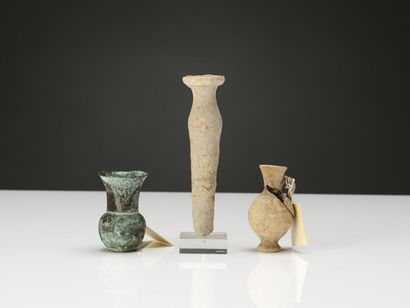 null Lot including a tubular vase, an amphorisk, an oenochoe, two jugs, five bottles...