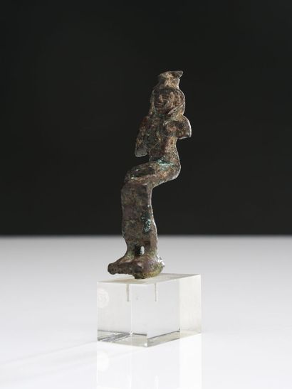 null Statuette of Isis lactans, representing the goddess Isis seated, holding her...