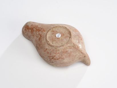 null Oil lamp with channel spout decorated with a medallion presenting a chrism.
Terra-cotta...