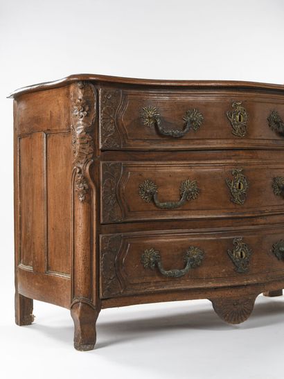 null Walnut chest of drawers molded and carved it opens with three drawers in front....