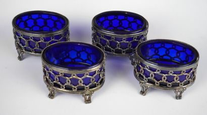 null Four oval silver salting bowls decorated with blue glass interiors.
Minerva...