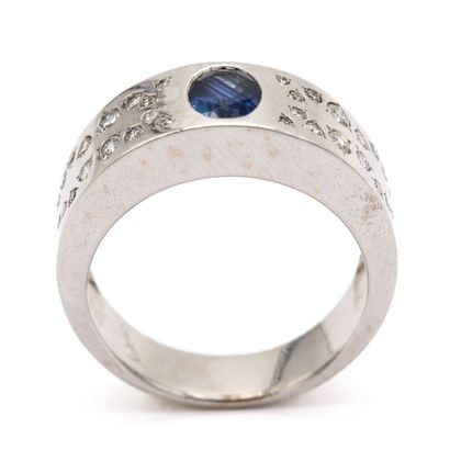null LELOUP Signed, band ring in 18K (750) white gold, set with an oval sapphire,...