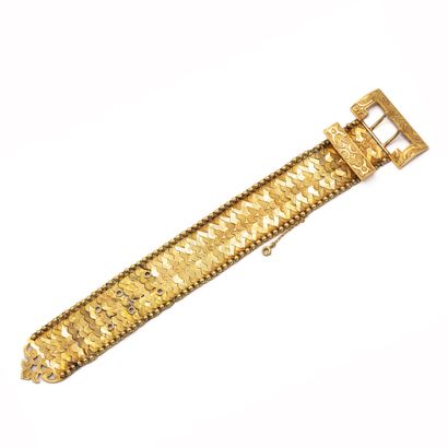 null Belt bracelet in 18 K (750) yellow gold, links in scales, chiseled and plain,...
