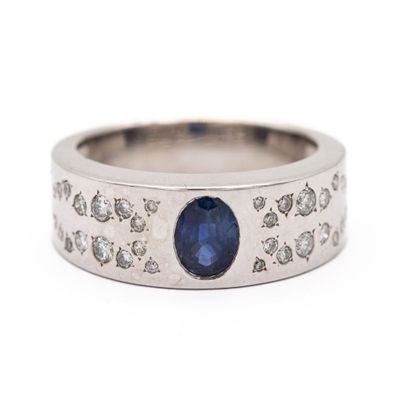 null LELOUP Signed, band ring in 18K (750) white gold, set with an oval sapphire,...