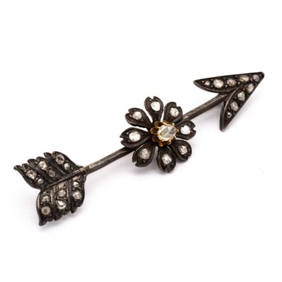 null Gold and silver brooch representing an arrow of Love, heightened by a daisy,...