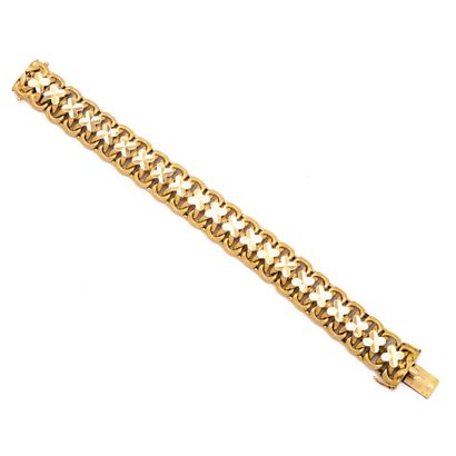 null Bracelet en or jaune 18 K (750) maille américaine, rehaussée d'un trèfle à quatre...