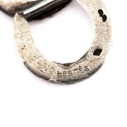 null HERMES Signed Silver bracelet, horseshoe rings, blackened silver.
Weight 29,10...