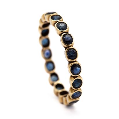 null American wedding band in 18K (750) yellow gold, fully set with sapphires. 
Some...
