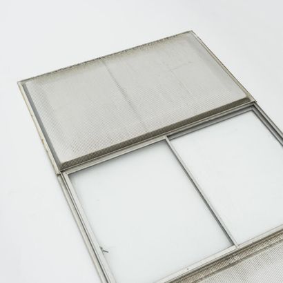 null Jean PROUVE (1901-1984)

Facade with two embossed aluminum panels and a sliding...