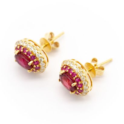 null Pair of ear studs in 18K yellow gold (750) set with two treated rubies totaling...