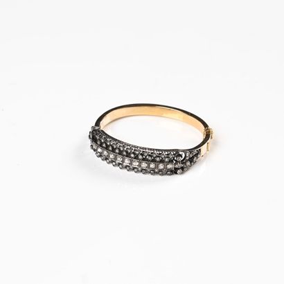 null 18K (750) rose gold openwork bangle, the upper part set with a line of diamonds,...