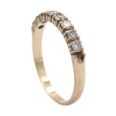 null American half wedding band in 18K (750) white gold set with eight diamonds....