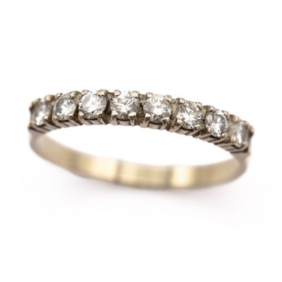 null American half wedding band in 18K (750) white gold set with eight diamonds....