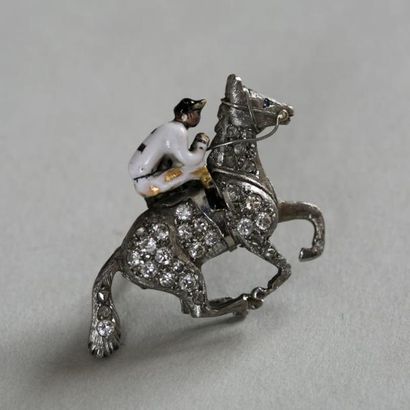 null Broche en platine, épigle en alliage 9K (375) figurant un jockey sur son cheval...