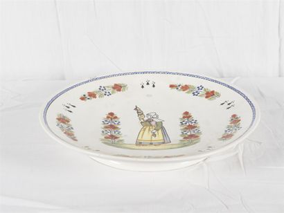 null HENRIOT QUIMPER, 
Plat circulaire en faïence
Diam : 42 cm