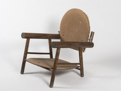 null Travail 1950 
Fauteuil «rondins» à structure en bois et assise et dossier garnis...