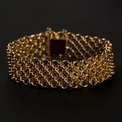 null Bracelet souple en or jaune (750) 18K à décor d'anneaux croisés. Poids : 32,30...