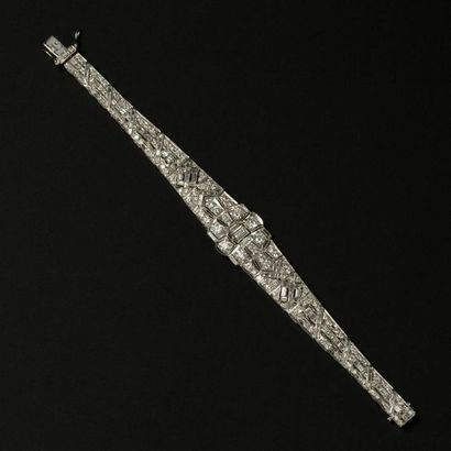 null Bracelet en or blanc 18k (750) entièrement serti de diamant, au centre un noeud...