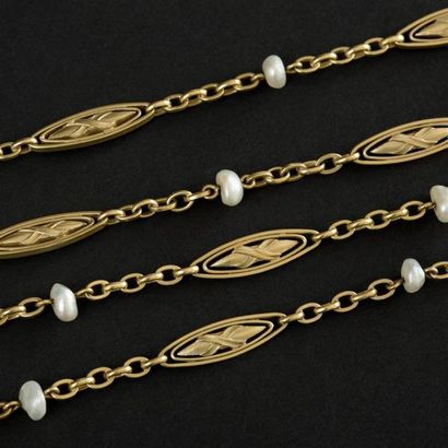 null Sautoir ancien en or jaune (750) 18K maillons oblongs alternés de perles baroques....