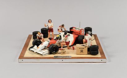 null Diorama of Ayrton Senna in the pit at the wheel of the McLaren Ford MP 4/8 in...