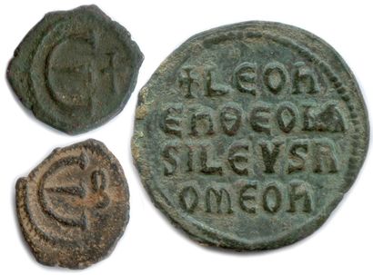 null Three Byzantine copper coins: 

Justin II and Sophie Pentanoummion; Maurice...