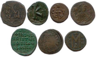 null Seven Byzantine bronze coins: 

Focas and Leontia, Justinian I, Constantine...