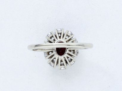 Ring Ring in 750-thousandths white gold, adorned with a facetted oval ruby set with...