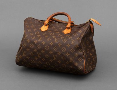Louis Vuitton LOUIS VUITTON - Sac à main speedy 35cm en toile monogramme et cuir...