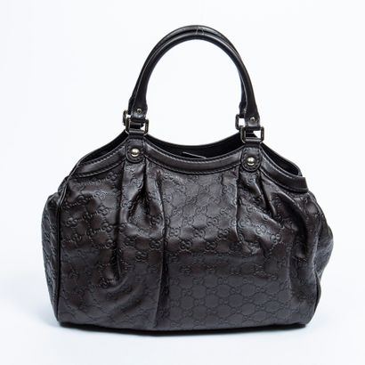 Gucci GUCCI - Hand or shoulder bag in brown leather embossed with the Gucci monogram...