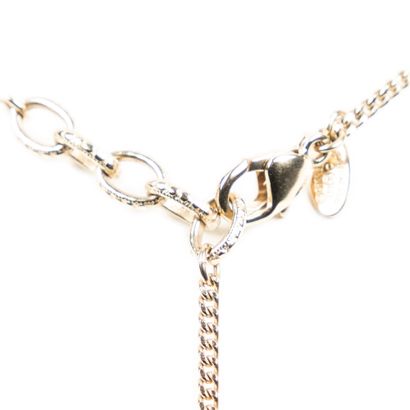 CHANEL CHANEL - Circa 1980, long necklace made of gilded metal chain, supporting...