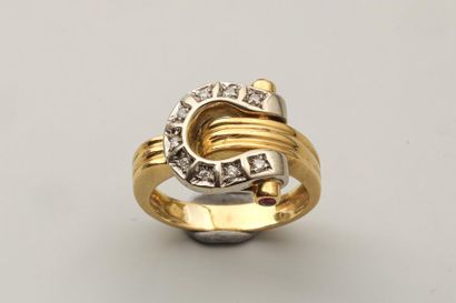 null 18k yellow gold ring decorated with a stirrup set with diamonds and surrounded...